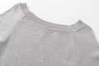 Slanted shoulder open shoulder long sleeved top