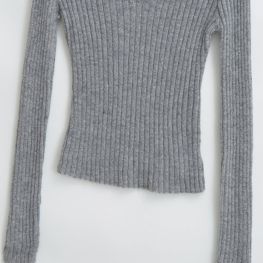 Haut à manches longues, col en V, coupe slim et bandeau élastique