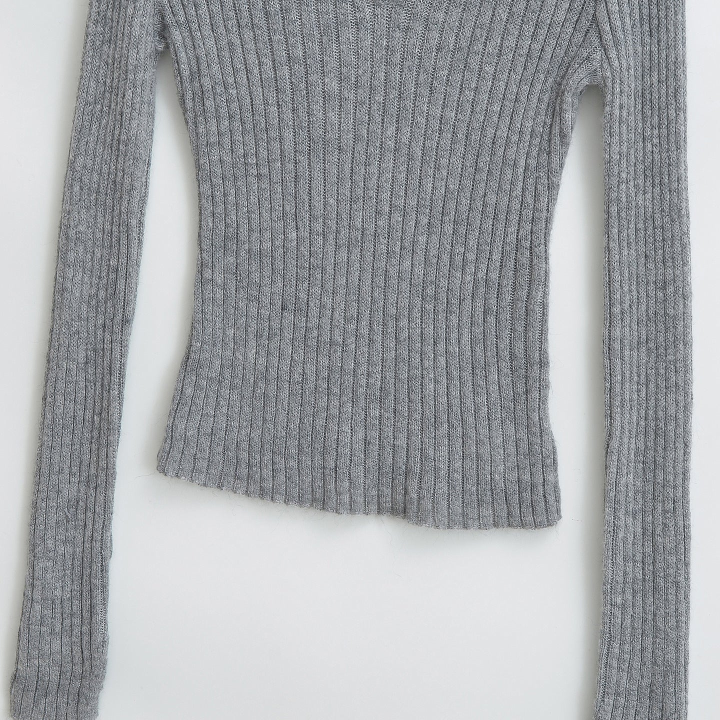Haut à manches longues, col en V, coupe slim et bandeau élastique